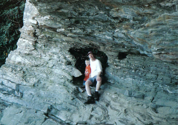 Boy and his dad happily embrace the risk, despite the danger sign
